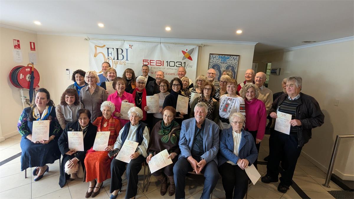 Volunteers with certificates from 5EBI, celebrating the station's 50th birthday last year